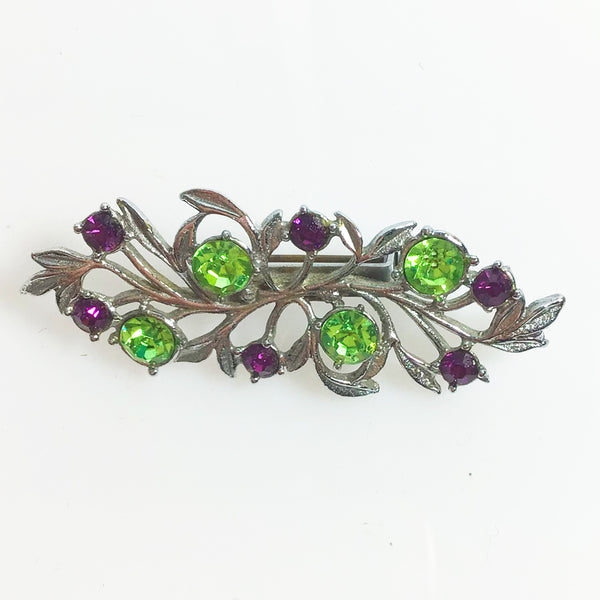 1960s silver tone bar brooch with green and amethyst rhinestones