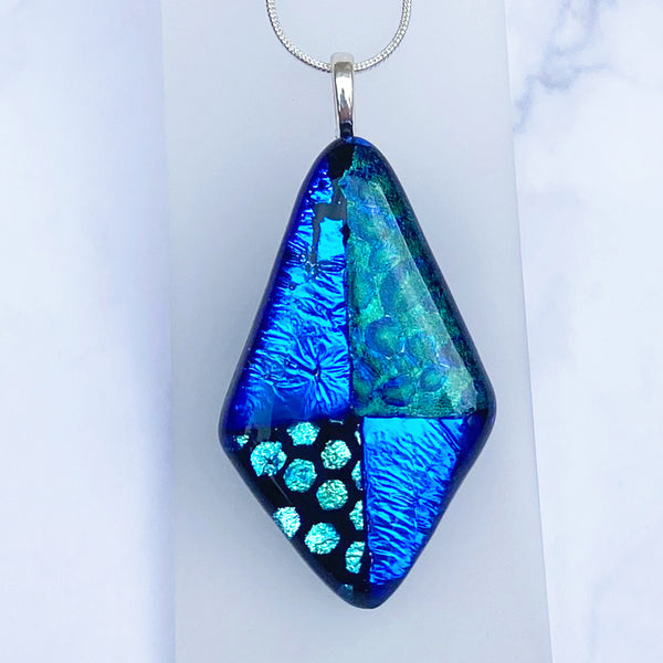 Dichroic fused glass pendant handmade by Studio 50 Glass, an exhibitor at the Rural Magpie Jewellery Fair