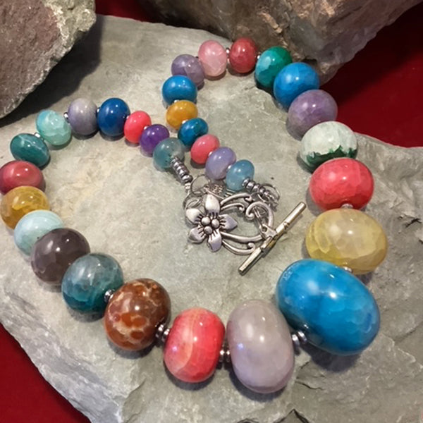 Multi-coloured agate necklace with large graduated beads. Handmade by Jadwiga Zaleski a Rural Magpie Jewellery Fair exhibitor. 