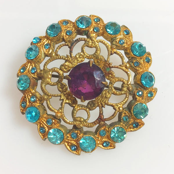 Vintage Czech filigree brooch with purple and blue crystals
