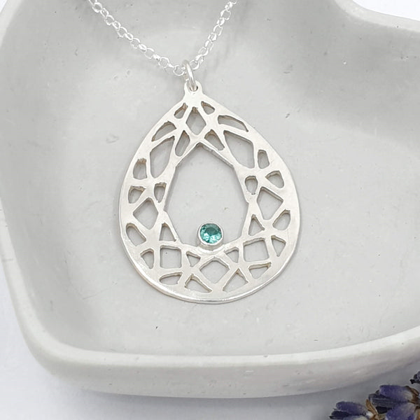 Handcrafted sterling silver teardrop with emerald. Made by Gina Kim a Rural Magpie Jewellery Fair exhibitor